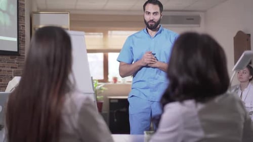 Man Giving Presentation in Medical Office