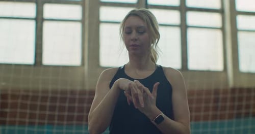 Blonde Woman Warming Up Hands for Sports
