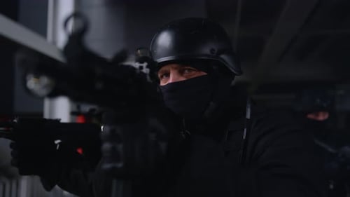 SWAT Team Carrying Rifles Wearing Black Uniforms