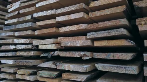 Sawn Boards in a Stack. Lumber at a Sawmill or Building