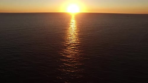 Sun Reflection on Sea Waves at Sunset