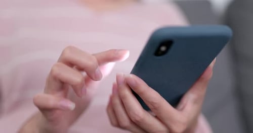 Hands Using Mobile Phone Close Up