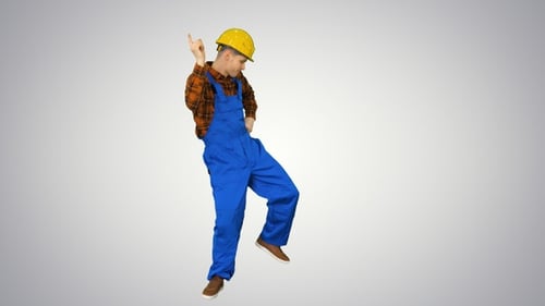 Dancing young engineer with helmet after work on gradient