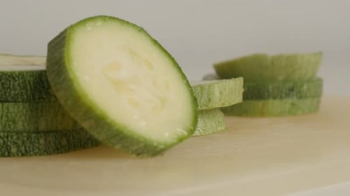 Tilting on Pepo cylindrica on cutting board close-up 4K 2160p 30fps UltraHD footage - Cuts of organi