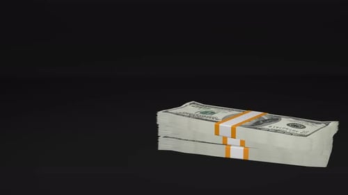 Viele Geldbündel fallen auf schwarzen Hintergrund. 100 US-Dollar-Banknoten.