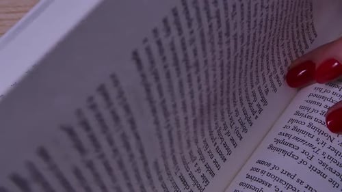 Elegant Hands Turning Pages of a Book
