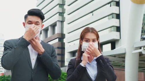 Group of young office businesspeople standing outdoor in city with new normal lifestyle.