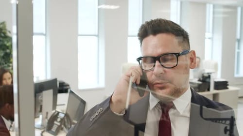 CEO Having Phone Call in Office