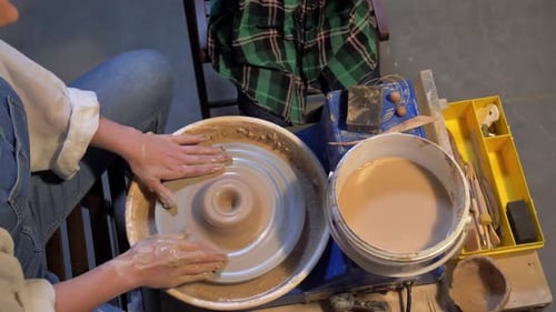 Slow Motion, Woman Works with Pottery Wheel in a Workshop