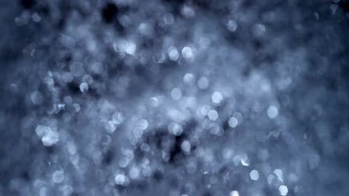 Abstrakte blaue Bokeh-Makro-Vollformat-Wassertropfen-Textur-Lop-Vorlage mit defokussierten