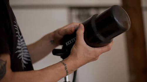 Close Up Hands of Young Man Getting Setting Up Lighting Equipment