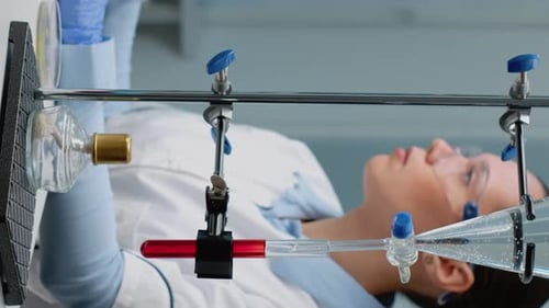 Scientist Working with Laboratory Glassware in Lab