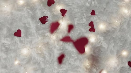 Red Hearts Confetti Falling on White Fur with Lights
