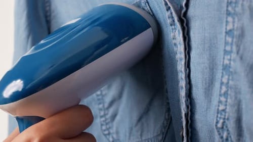 Steaming a Light Blue Denim Shirt at Home