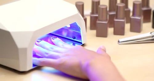 Woman applying nail polish