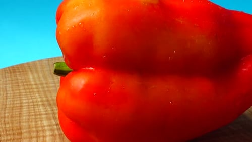 Close Up of Shiny Red Bell Pepper on Board