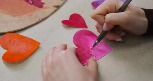 Writing on Pink Hearts Close Up