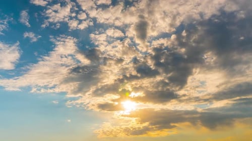Sun and clouds at dawn, time-lapse