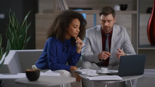 Mixed Race Business Couple Working Laptop Computer at Remote Workplace Office