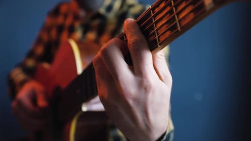 Man Playing Acoustic Guitar Close Up