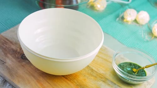 Flour Being Poured into Bowl in Kitchen