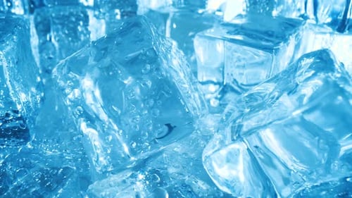 Wet Ice Cubes Glistening in Blue Light