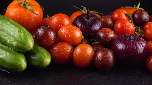 Fresh Vegetables: Wet Cucumbers, Tomatoes, and Onion