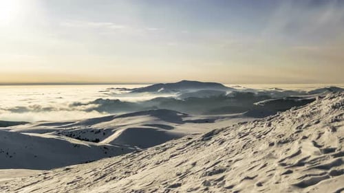 Snowy Mountains and Clouds on a Winter Day