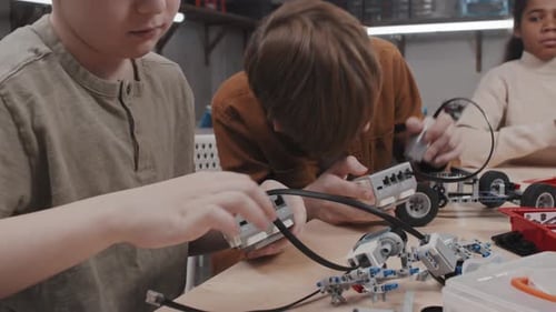 Modern Boys Building Robotic Models
