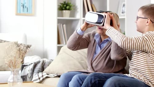Woman Tries Virtual Reality Headset with Teen Boy