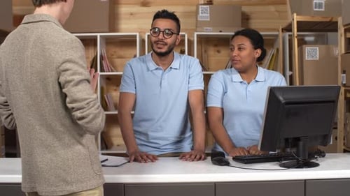 Customer Picking up Parcel at Post Office