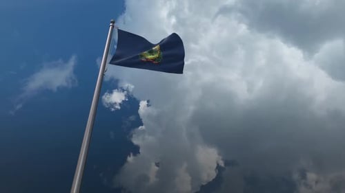 Vermont State Flag Waving Against Dynamic Clouds