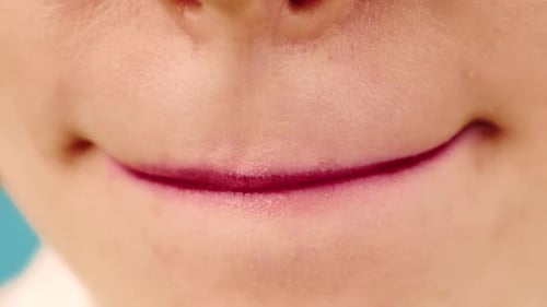 Close-up of Lips with Red Lipstick Smudging