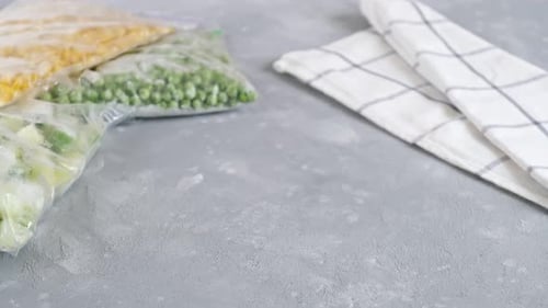 Preparing Frozen Vegetables in a Clear Glass Bowl