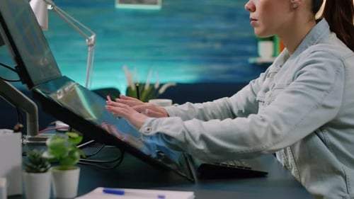 Woman Works on Touchscreen Monitor at Her Desk