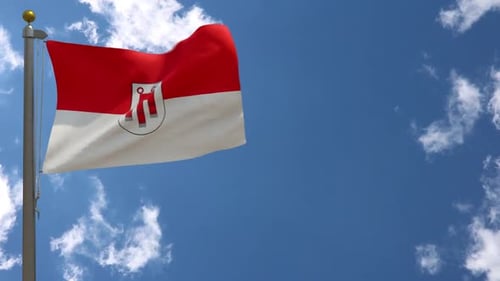 Waving Red And White Flag With Coat Of Arms In Blue Sky