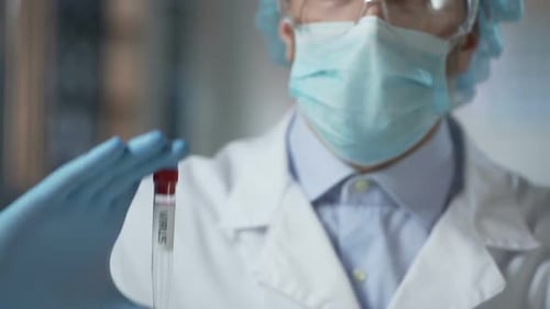 Scientist Holding Virus Test Tube in Laboratory