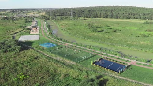 Aerial shot of basketball and football courts. Sports playground.