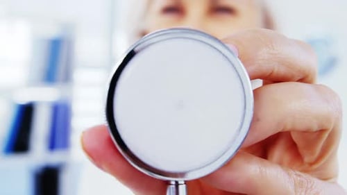 Close-up of female doctor holding stethoscope