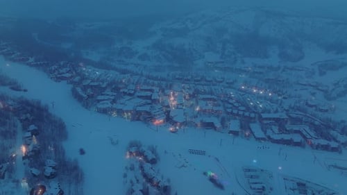 Dusk Over a Beautiful Nordic Village with Magical Snowfall Above
