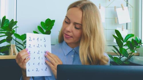 Young Woman Teaching Math Online From Home