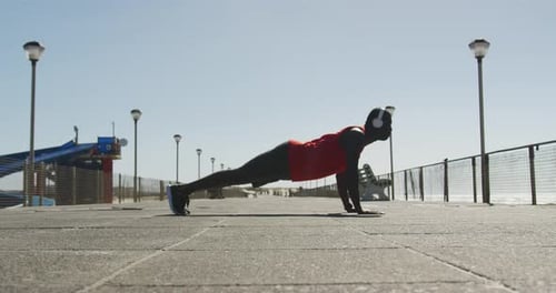 Athletic Man Doing Pushups on Boardwalk