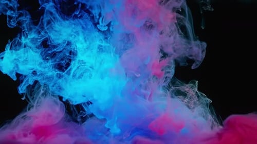 Abstract Blue and Pink Ink Swirls in Darkness