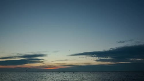 Sunset Sky Above Tranquil Rippling Water