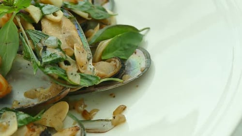 Close Up Mussels on White Plate
