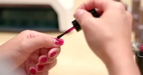 Applying Red Nail Polish for a Manicure