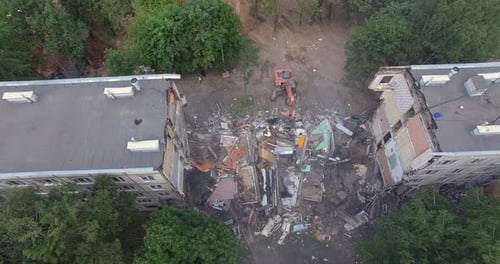 Building Demolition with Machinery. Aerial View of House Ruins