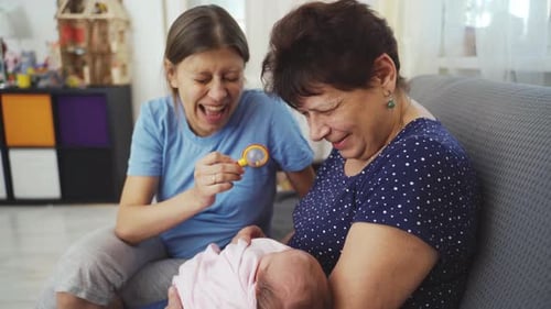 Three Generations: Baby, Mother, and Grandmother Relaxing at Home