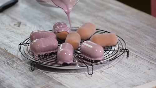 Pouring Glossy Lavender Glaze on Cakes