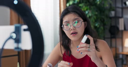 Woman Vlogging About Makeup With Ring Light